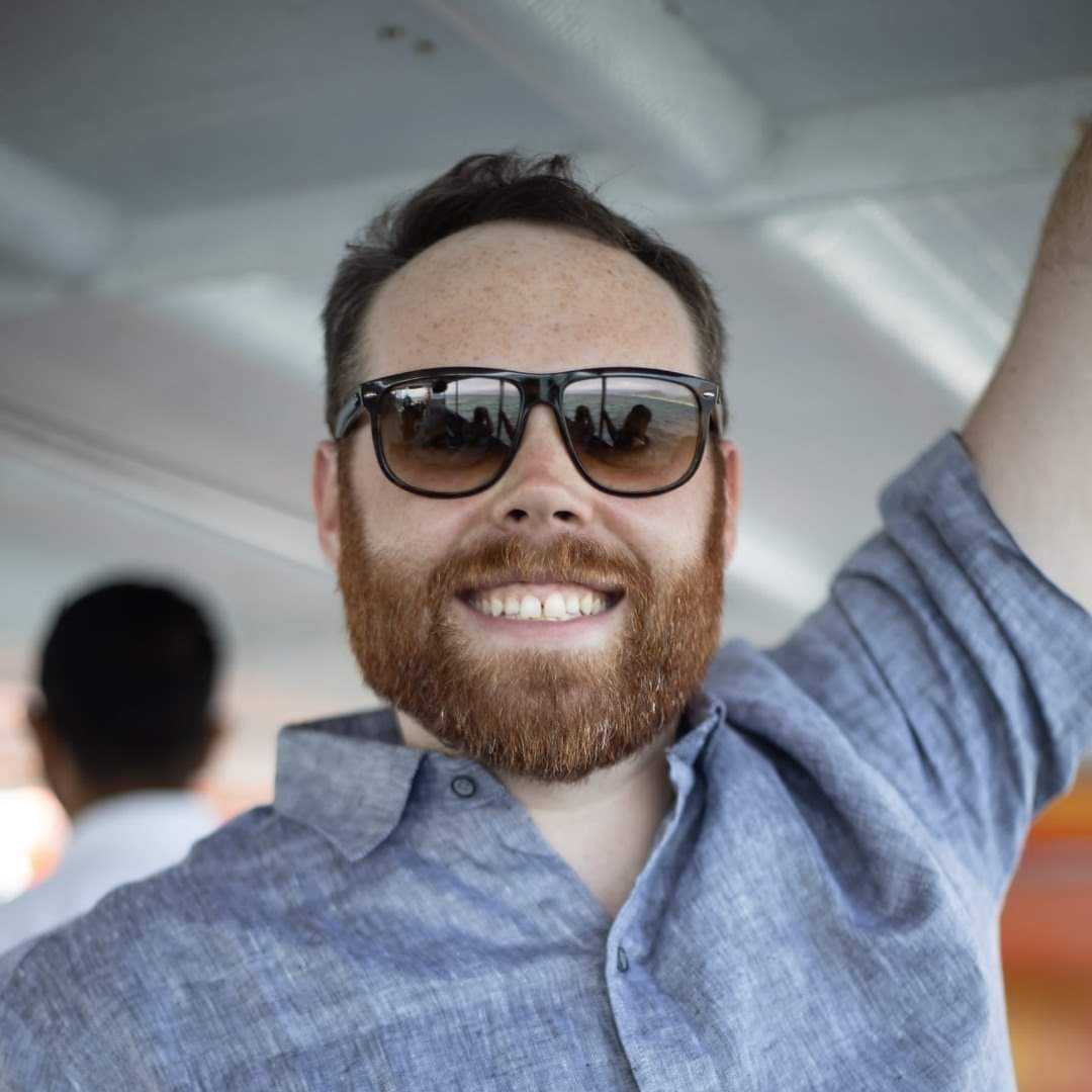 Dan Haggerty smiling wearing sunglasses